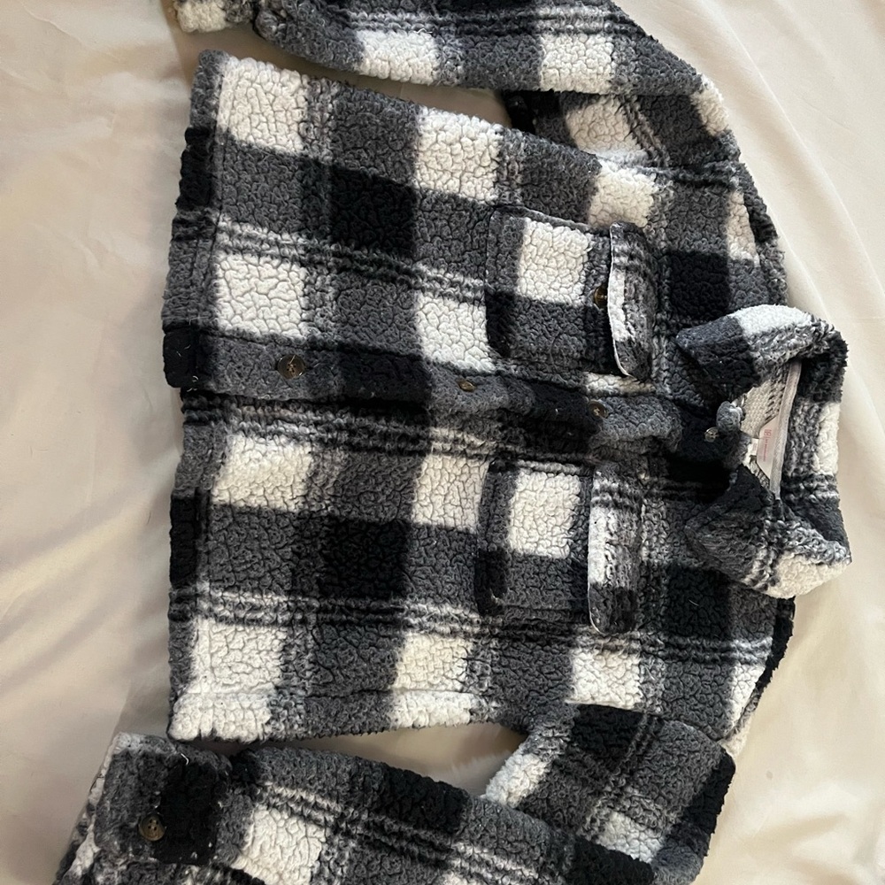 A black and white and gray patterned sweater